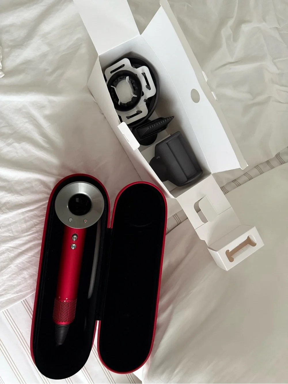 Dyson Hair Dryer with Red and Silver Accessories
